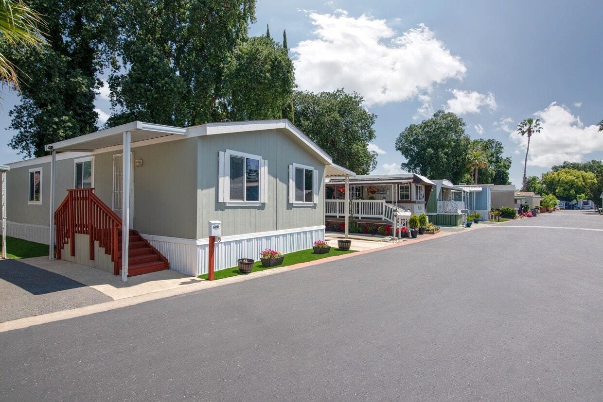 Manufactured housing community street with mature landscaping